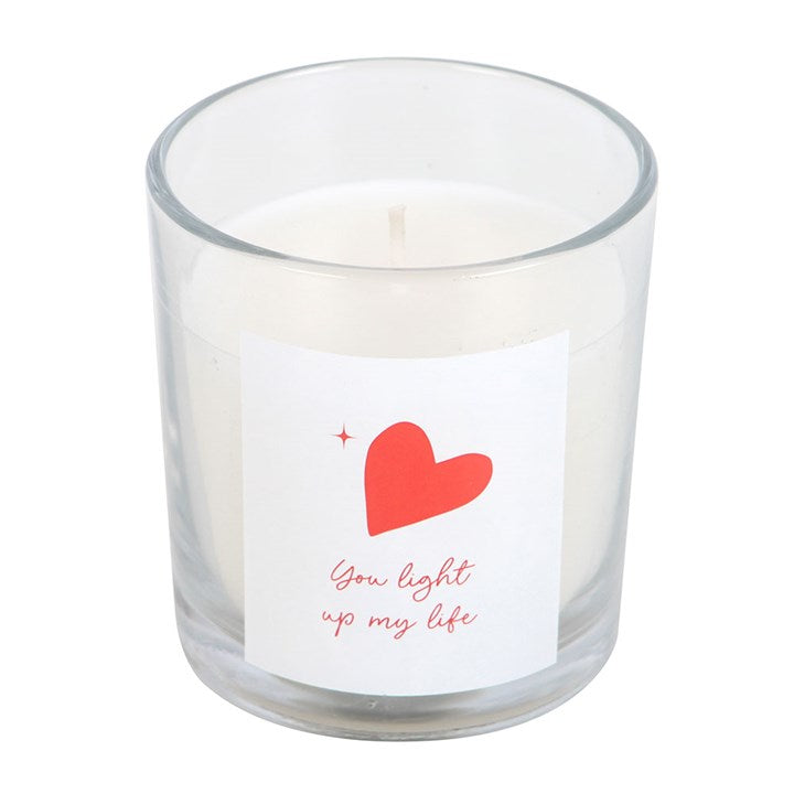 You Light Up My Life strawberry scented candle in a clear glass jar with a red heart design and matching white gift box, perfect for romantic occasions or thoughtful gifts