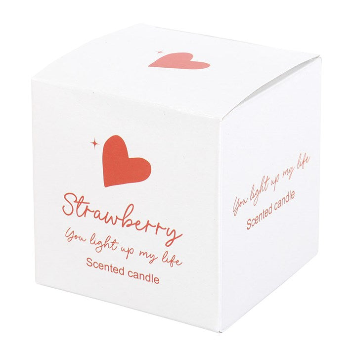 You Light Up My Life strawberry scented candle in a clear glass jar with a red heart design and matching white gift box, perfect for romantic occasions or thoughtful gifts