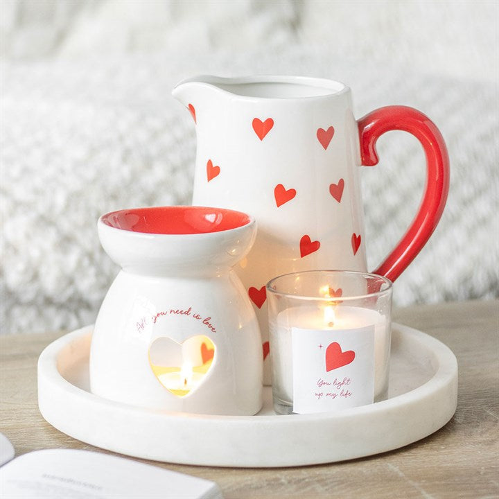 You Light Up My Life strawberry scented candle in a clear glass jar with a red heart design and matching white gift box, perfect for romantic occasions or thoughtful gifts