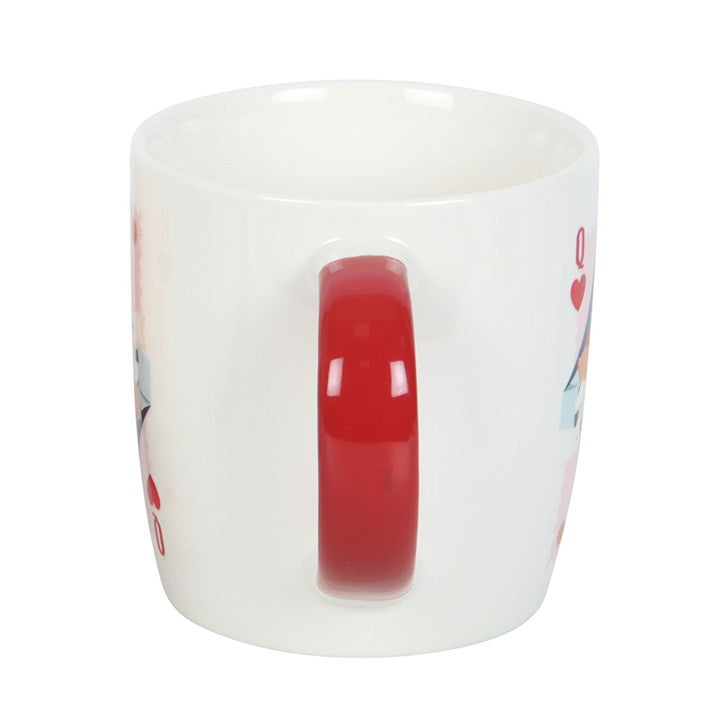 A white ceramic mug with a red handle featuring a queen of hearts playing card design and the phrase “Her Ladyship.” The mug sits on a white circular tray, offering a classy and playful tribute to the leading lady in your life.