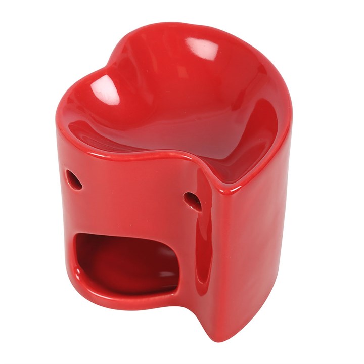 Red ceramic heart-shaped oil burner and wax warmer, perfect for creating a romantic ambiance with essential oils or wax melts. Stylish and functional home fragrance accessory.
