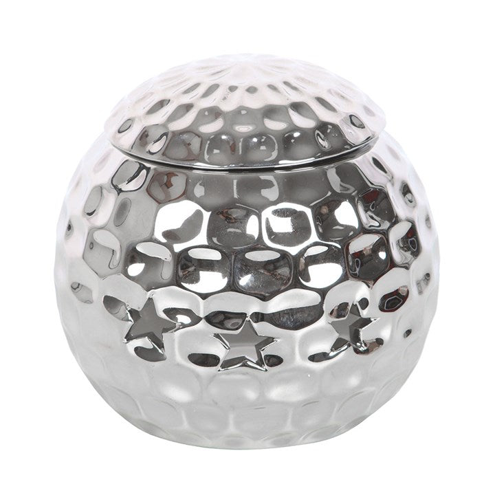 Silver disco ball oil burner with a hammered metallic finish and star-shaped cutouts, perfect for creating a stylish and modern ambiance with wax melts or essential oils