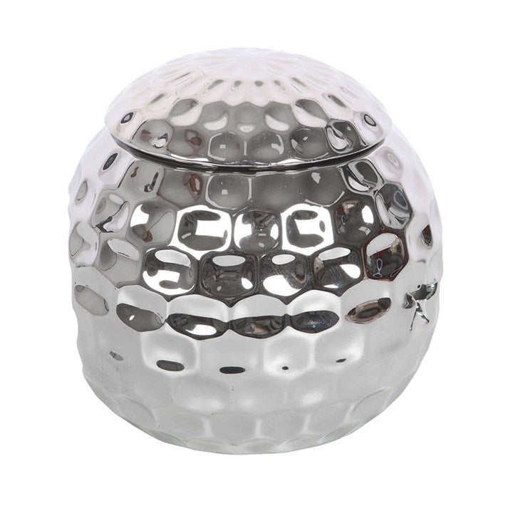 Silver disco ball oil burner with a hammered metallic finish and star-shaped cutouts, perfect for creating a stylish and modern ambiance with wax melts or essential oils