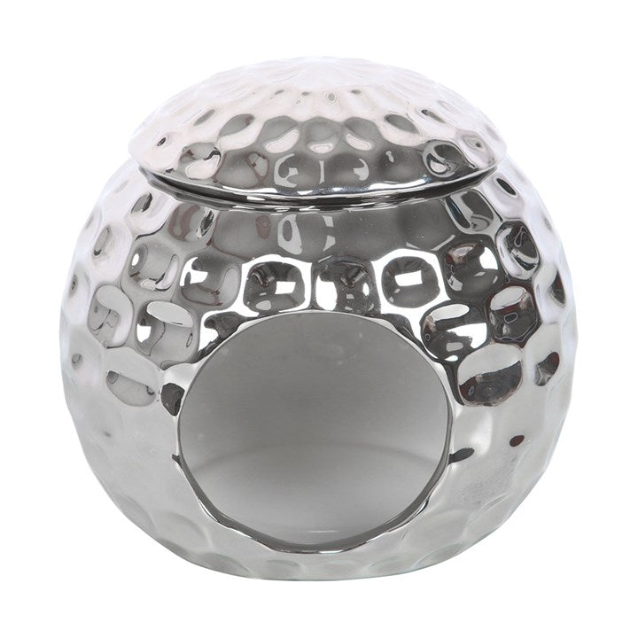 Silver disco ball oil burner with a hammered metallic finish and star-shaped cutouts, perfect for creating a stylish and modern ambiance with wax melts or essential oils
