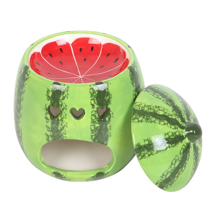 A beautifully designed watermelon-shaped scented candle housed in a glossy ceramic jar with a removable lid resembling a watermelon rind.