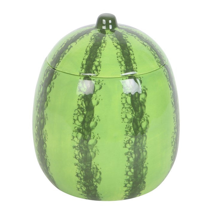 A beautifully designed watermelon-shaped scented candle housed in a glossy ceramic jar with a removable lid resembling a watermelon rind.