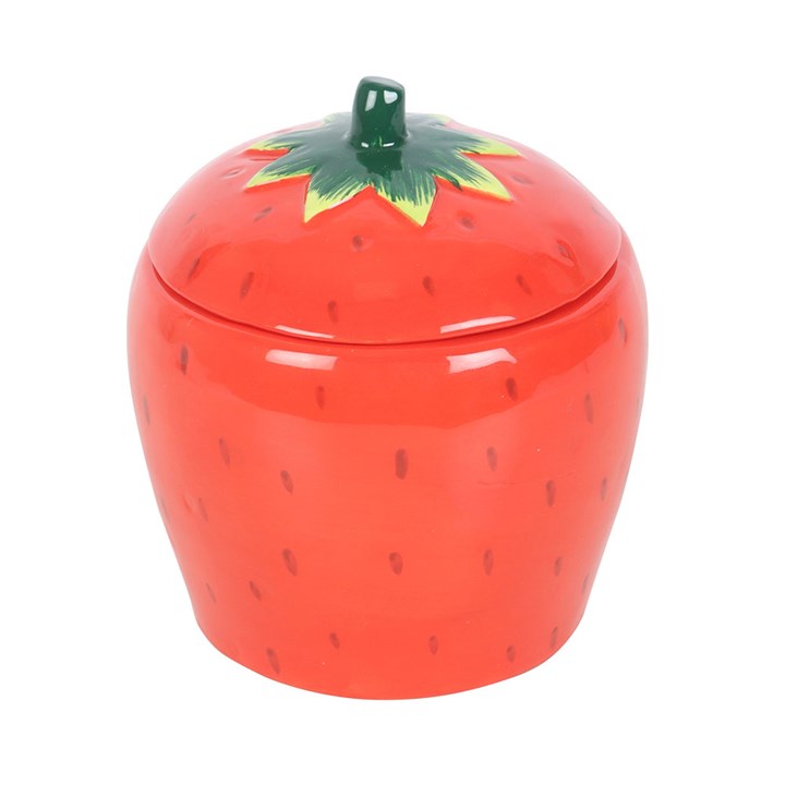 A beautifully designed strawberry-shaped scented candle housed in a glossy ceramic jar with a removable lid featuring a green leafy top.