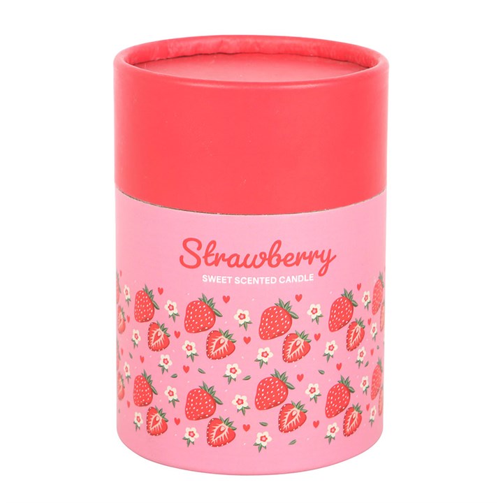 A strawberry-scented candle in a transparent glass jar with a pink floral and strawberry print label