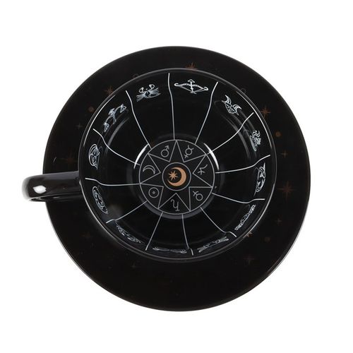 Black celestial teacup and saucer set featuring an astrology wheel with zodiac signs in white and gold detailing, designed for tea leaf reading and divination. 500ml capacity