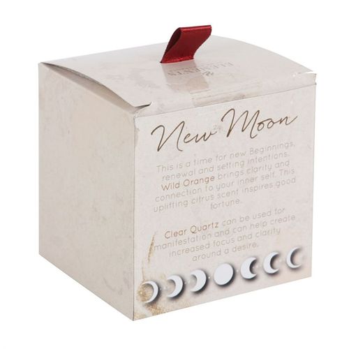 New Moon Wild Orange Manifestation Candle with Clear Quartz, featuring a frosted glass jar, copper lid, and elegant gold moon detail. Perfect for setting intentions and creating a calming atmosphere.