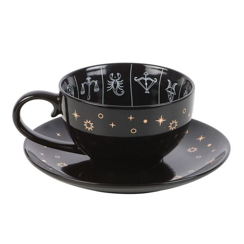 Black celestial teacup and saucer set featuring an astrology wheel with zodiac signs in white and gold detailing, designed for tea leaf reading and divination. 500ml capacity