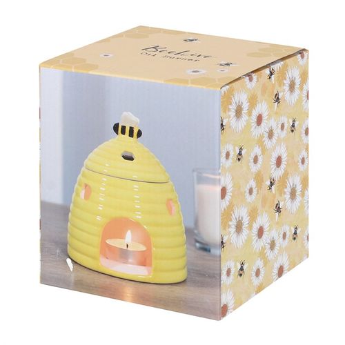Yellow ceramic beehive-shaped oil burner with hexagonal cutouts and a cute bee accent on top, perfect for diffusing essential oils or wax melts to create a cozy atmosphere