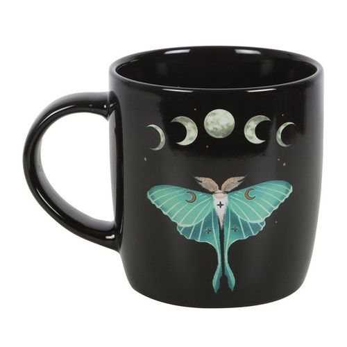 A glossy black ceramic mug featuring a detailed illustration of a teal luna moth, surrounded by moon phases, stars, and floral accents. The design evokes a mystical, nature-inspired aesthetic.