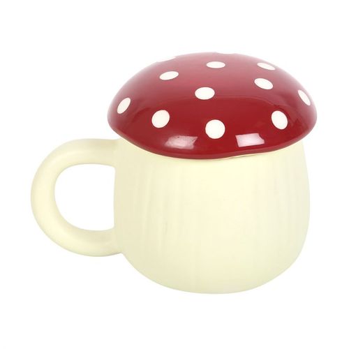 A novelty ceramic mug shaped like a mushroom, with a cream-colored base and a glossy red lid topped with white polka dots. The design mimics a toadstool, giving it a playful, whimsical look.
