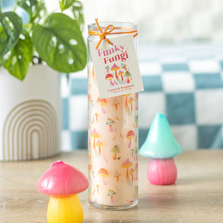 Funky Fungi Mushroom Print Tube Candle with a colorful mushroom design, lemon and bergamot fragrance, and an orange ribbon accent. Perfect for home decor or gifting