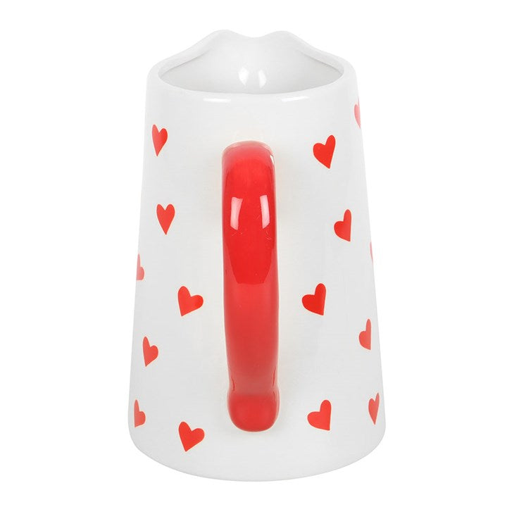 Heart Print Ceramic Flower Vase with a white base, red heart pattern, and a vibrant red handle. Perfect for displaying fresh flowers or as a decorative centerpiece for your home.