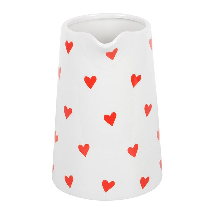 Heart Print Ceramic Flower Vase with a white base, red heart pattern, and a vibrant red handle. Perfect for displaying fresh flowers or as a decorative centerpiece for your home.