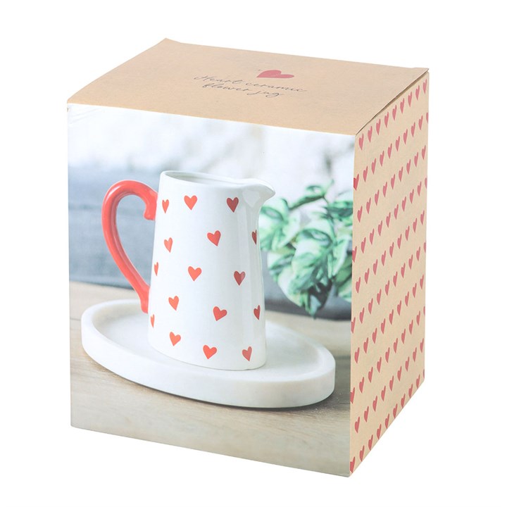 Heart Print Ceramic Flower Vase with a white base, red heart pattern, and a vibrant red handle. Perfect for displaying fresh flowers or as a decorative centerpiece for your home.