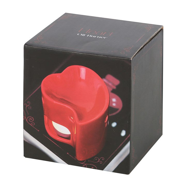 Red ceramic heart-shaped oil burner and wax warmer, perfect for creating a romantic ambiance with essential oils or wax melts. Stylish and functional home fragrance accessory.