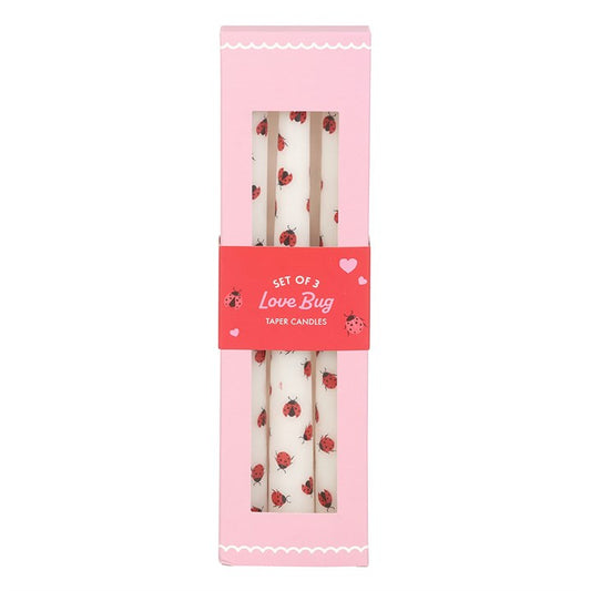 Set of 3 Love Bug taper candles with adorable ladybird designs, packaged in a pink box with a heart-themed label, perfect for romantic or whimsical decor