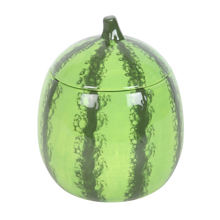 A watermelon-shaped scented candle in a glossy ceramic jar with a removable lid, featuring a realistic green rind design.