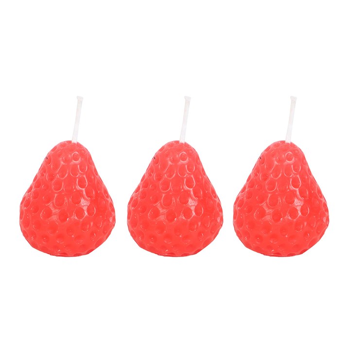 A set of three unscented, strawberry-shaped candles with a textured surface, placed on a wooden board. The candles have a vibrant red-orange hue and white wicks, adding a decorative touch