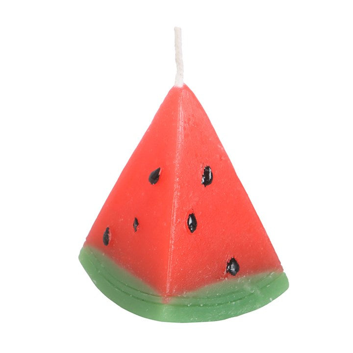 A set of three unscented, watermelon-shaped candles with a triangular design, featuring a red wax body with black seed-like details and a green base