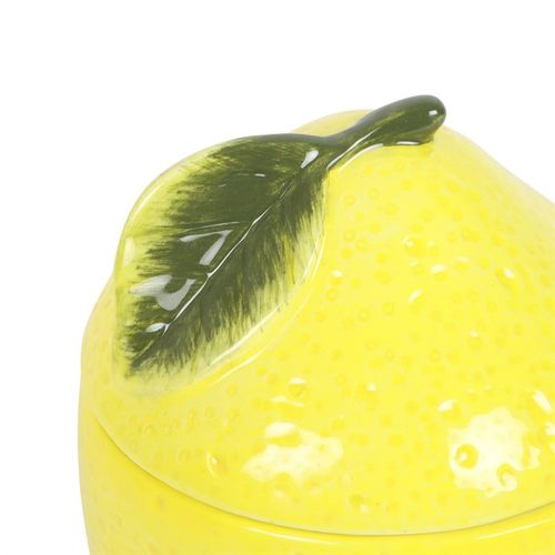Bright yellow ceramic lemon oil burner with a textured surface and lemon slice design on top, perfect for melting wax or diffusing essential oils to create a refreshing ambiance