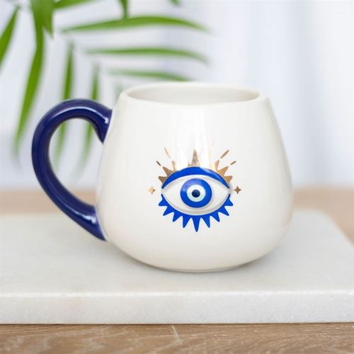 White rounded ceramic mug featuring a striking All-Seeing Eye design with metallic gold accents, symbolizing protection, good luck, and positive energy. 500ml capacity.