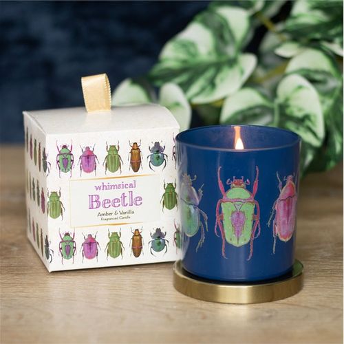 Whimsical beetle-themed  Amber and Vanilla scented candle with a navy blue jar, colorful beetle design, and a gold lid, paired with a matching decorative box. Amber and vanilla fragrance, perfect for unique home decor and gifting.