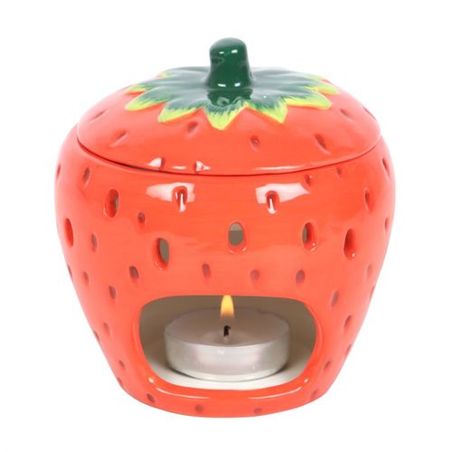 A ceramic strawberry-shaped oil burner with a removable lid, featuring a glossy red finish with tiny seed details and a green leafy top. The playful and vibrant design makes it a charming addition to any home décor.